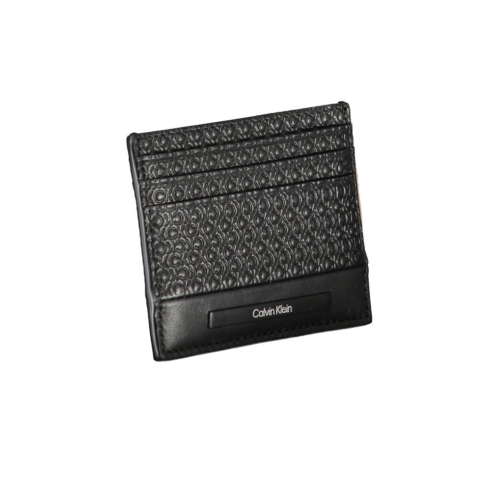 Sleek Black Contrast Card HolderEmbrace the epitome of modern sophistication with this sleek Calvin Klein card holder. Designed for the minimalist who appreciates a touch of elegance, this accessory boasts a central pocket lined with contrast details and