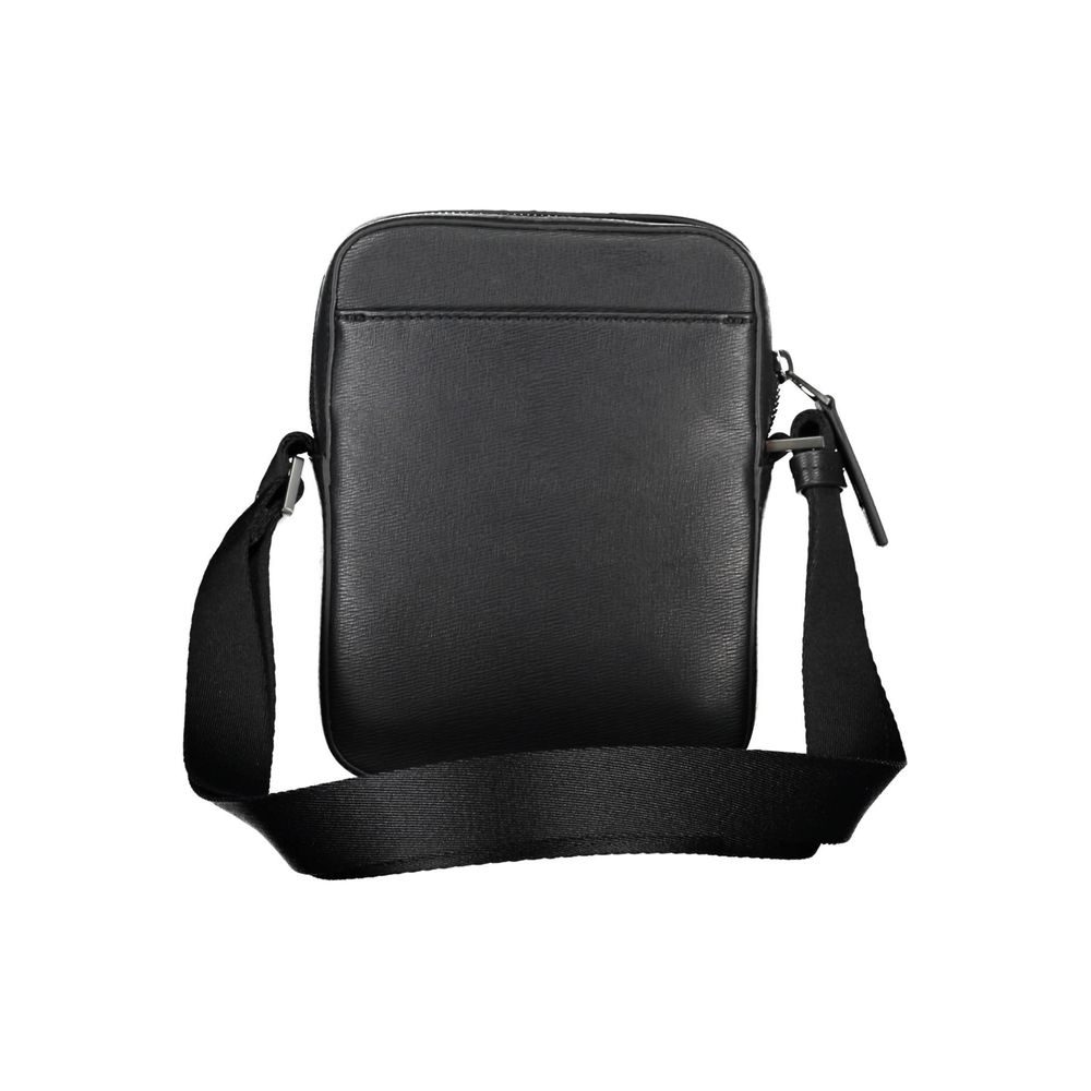 Elegant Black Shoulder Bag with Sleek DetailingExperience the perfect blend of functionality and style with this exquisite shoulder bag from the renowned Calvin Klein collection. Designed for the modern individual, it features an adjustable shoulder strap