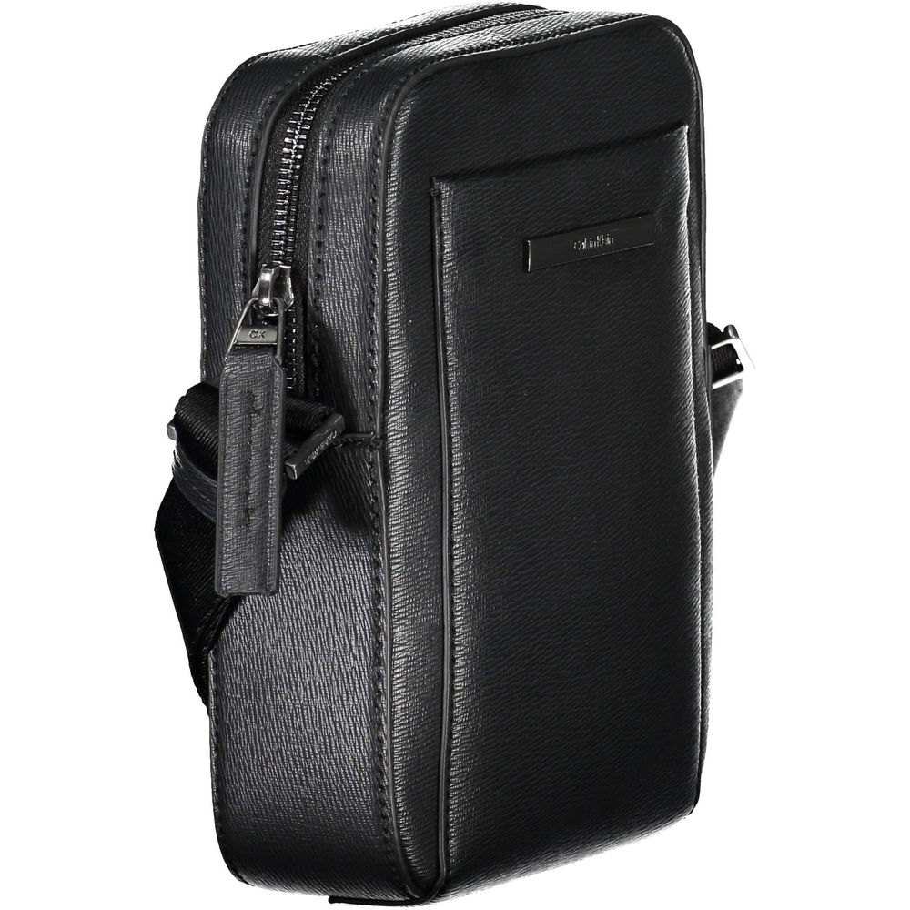 Elegant Black Shoulder Bag with Sleek DetailingExperience the perfect blend of functionality and style with this exquisite shoulder bag from the renowned Calvin Klein collection. Designed for the modern individual, it features an adjustable shoulder strap