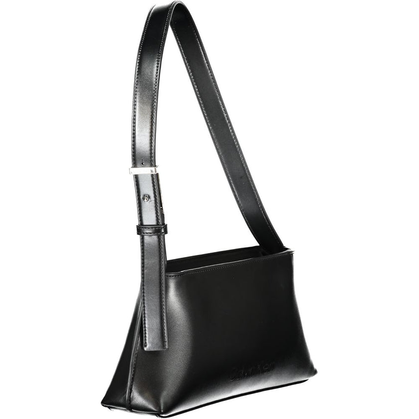 Black Polyester Women HandbagIndulge in the epitome of sleek sophistication with this Calvin Klein masterpiece. Exquisitely crafted with an eye for modernity, this handbag is your ideal accompaniment for a statement-making entrance. Featuring an adjustabl
