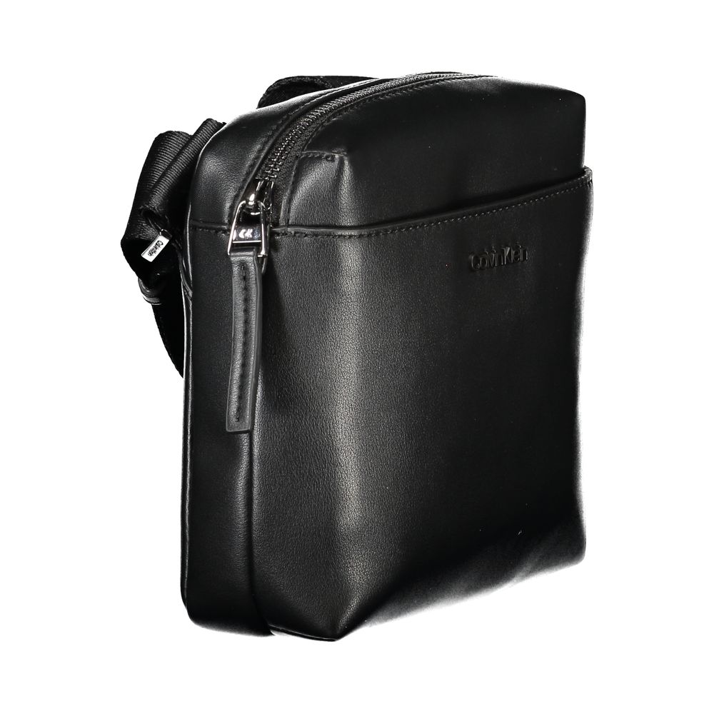 Black Polyethylene Men Shoulder BagElevate your accessory game with the sleek and stylish Calvin Klein shoulder bag, designed for the modern trendsetter. Crafted from premium 100% polyethylene for durability with a minimalist aesthetic, this bag features