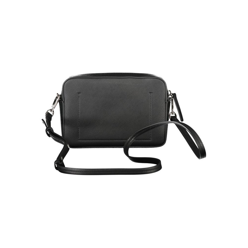 Black Polyethylene Women HandbagElevate your ensemble with the sleek sophistication of the Calvin Klein handbag. A versatile accessory that boasts an adjustable and removable shoulder strap, tailored for your comfort and style preference. This chic bag fe