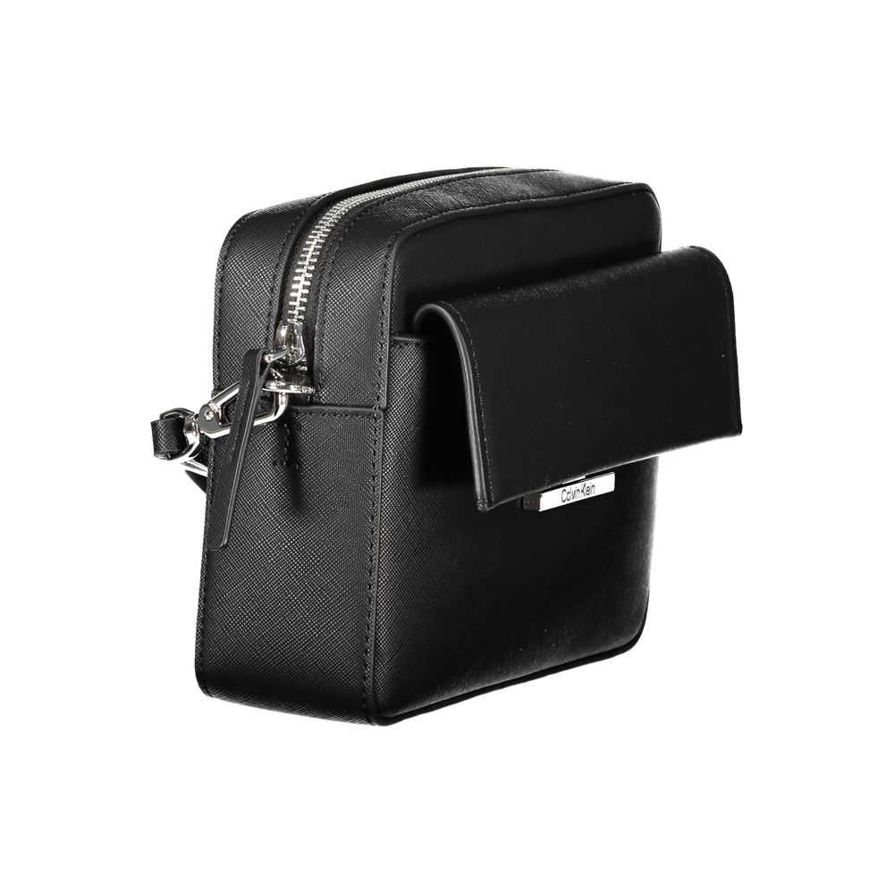 Black Polyethylene Women HandbagElevate your ensemble with the sleek sophistication of the Calvin Klein handbag. A versatile accessory that boasts an adjustable and removable shoulder strap, tailored for your comfort and style preference. This chic bag fe