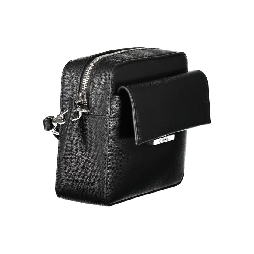Black Polyethylene Women HandbagElevate your ensemble with the sleek sophistication of the Calvin Klein handbag. A versatile accessory that boasts an adjustable and removable shoulder strap, tailored for your comfort and style preference. This chic bag fe