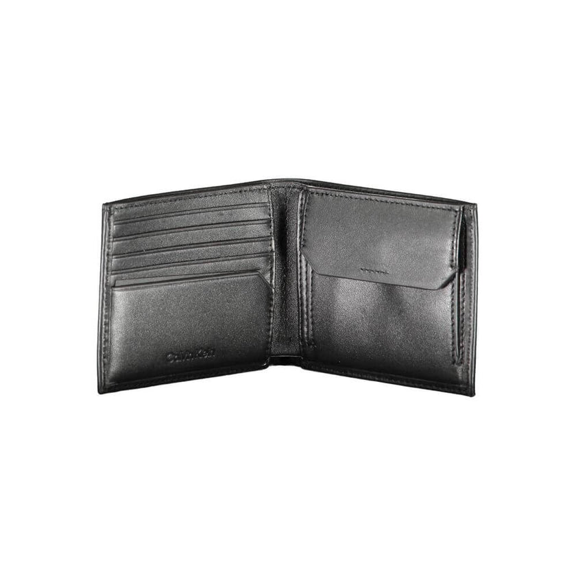 Black Leather Men WalletPresenting the ultimate fusion of sophistication and practicality – the Calvin Klein Leather Wallet. This sleek black accessory doesn’t just carry your essentials; it guards them too. With RFID blocking technology, your cards stay