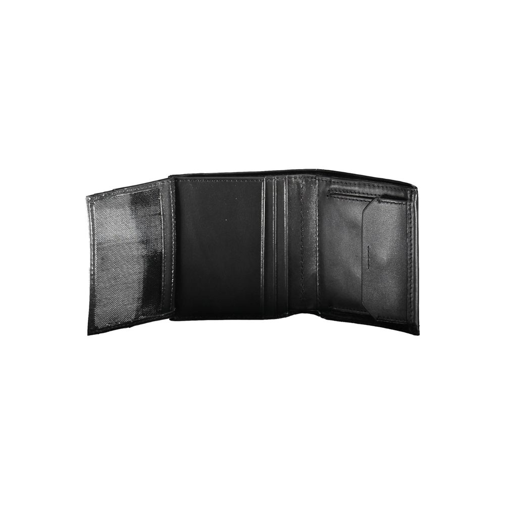 Black Leather Men WalletCrafted with the modern gentleman in mind, this Calvin Klein wallet is the epitome of sleek sophistication. A design that resonates with the brand’s minimalist aesthetic, it boasts two spacious compartments, a coin purse tailored f