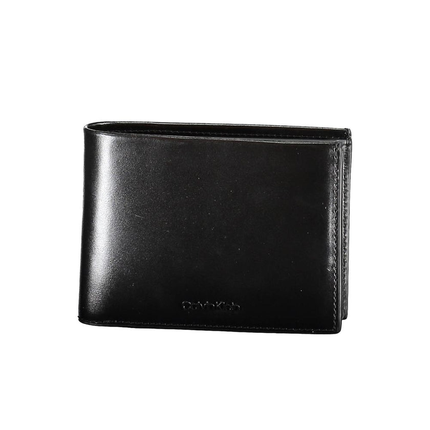 Black Leather Men WalletIndulge in the epitome of sophistication with this Calvin Klein wallet, crafted for the modern man who values security as much as style. It embodies functionality with its dual compartments, a secure coin purse, and ample card slot