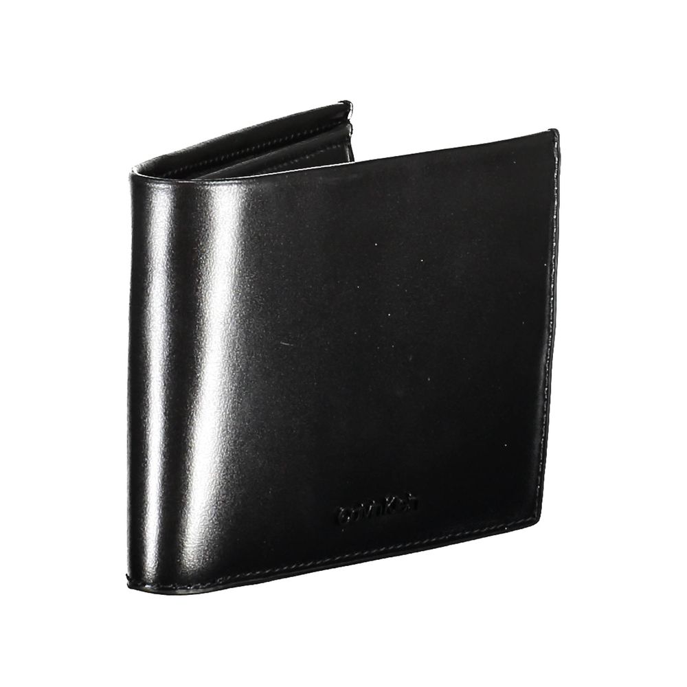 Black Leather Men WalletIndulge in the epitome of sophistication with this Calvin Klein wallet, crafted for the modern man who values security as much as style. It embodies functionality with its dual compartments, a secure coin purse, and ample card slot