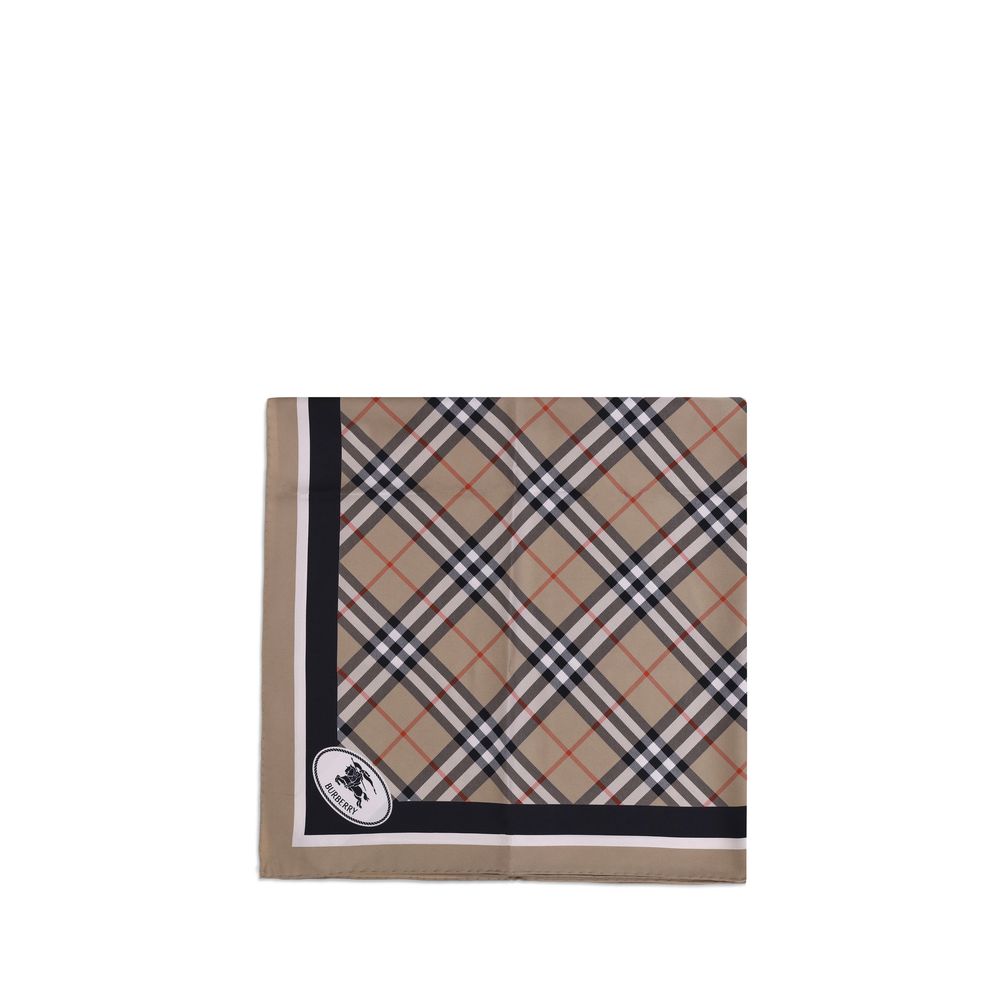 Silk Check ScarfBurberry’s silk Check Scarf is an iconic and refined accessory featuring the classic Burberry Check print. Contrasting stripes on the edges, the archival Knight Stamp pattern and Burberry lettering printed on the corners complete the desig