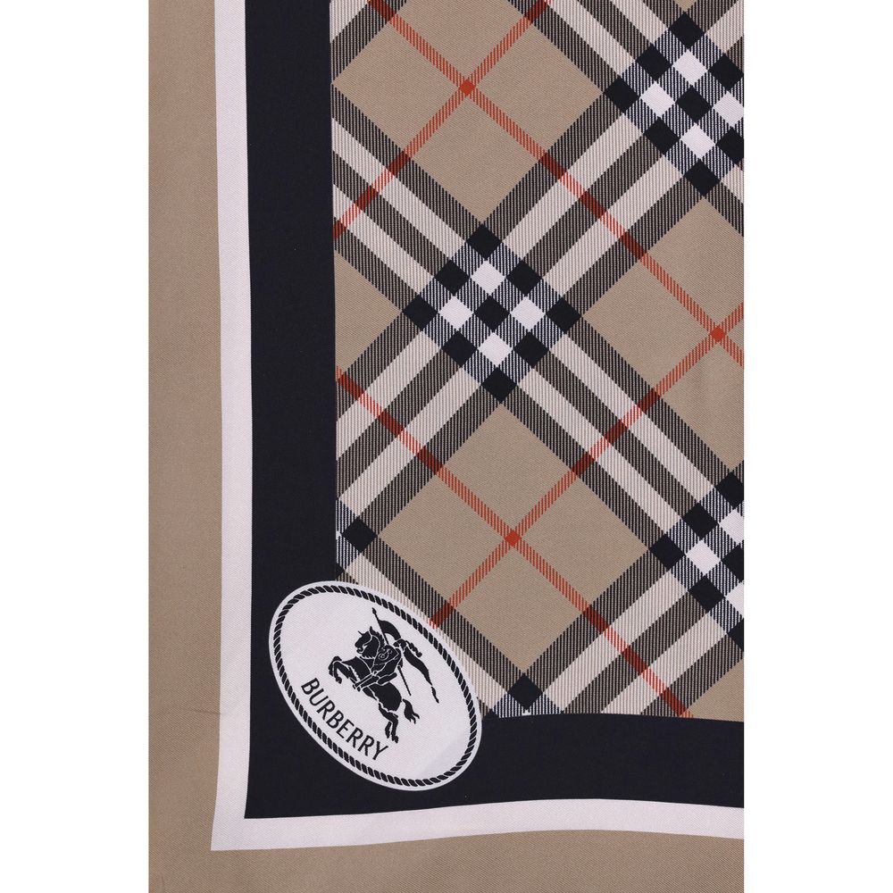 Silk Check ScarfBurberry’s silk Check Scarf is an iconic and refined accessory featuring the classic Burberry Check print. Contrasting stripes on the edges, the archival Knight Stamp pattern and Burberry lettering printed on the corners complete the desig