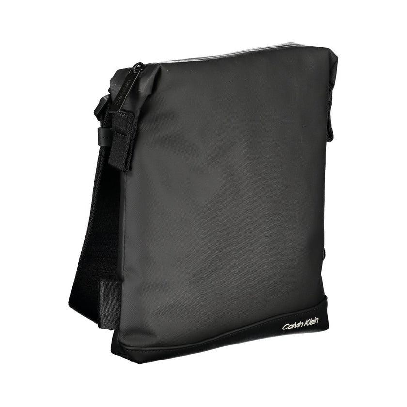Elegant Black Shoulder Bag with Contrast DetailsDiscover the perfect blend of sophistication and practicality with this elegant, black shoulder bag from Calvin Klein. The adjustable shoulder strap ensures a comfortable fit, while the interior pocket keeps