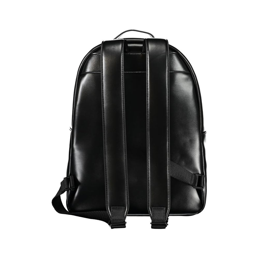 Elegant Black Urban Backpack with Laptop CompartmentUpgrade your accessory game with the Calvin Klein Backpack, tailored for the modern urbanite. This stylish backpack features a convenient single handle design, adjustable straps for personalized comfort,