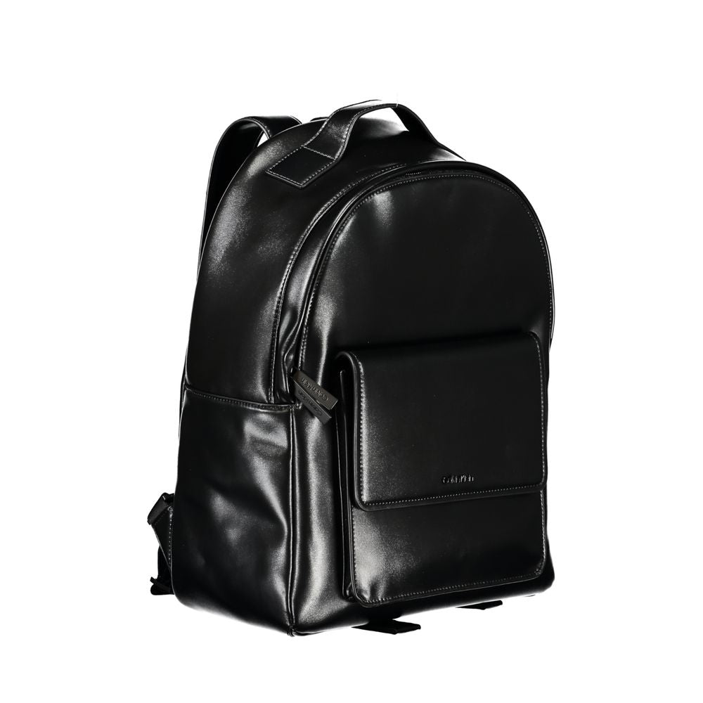 Elegant Black Urban Backpack with Laptop CompartmentUpgrade your accessory game with the Calvin Klein Backpack, tailored for the modern urbanite. This stylish backpack features a convenient single handle design, adjustable straps for personalized comfort,