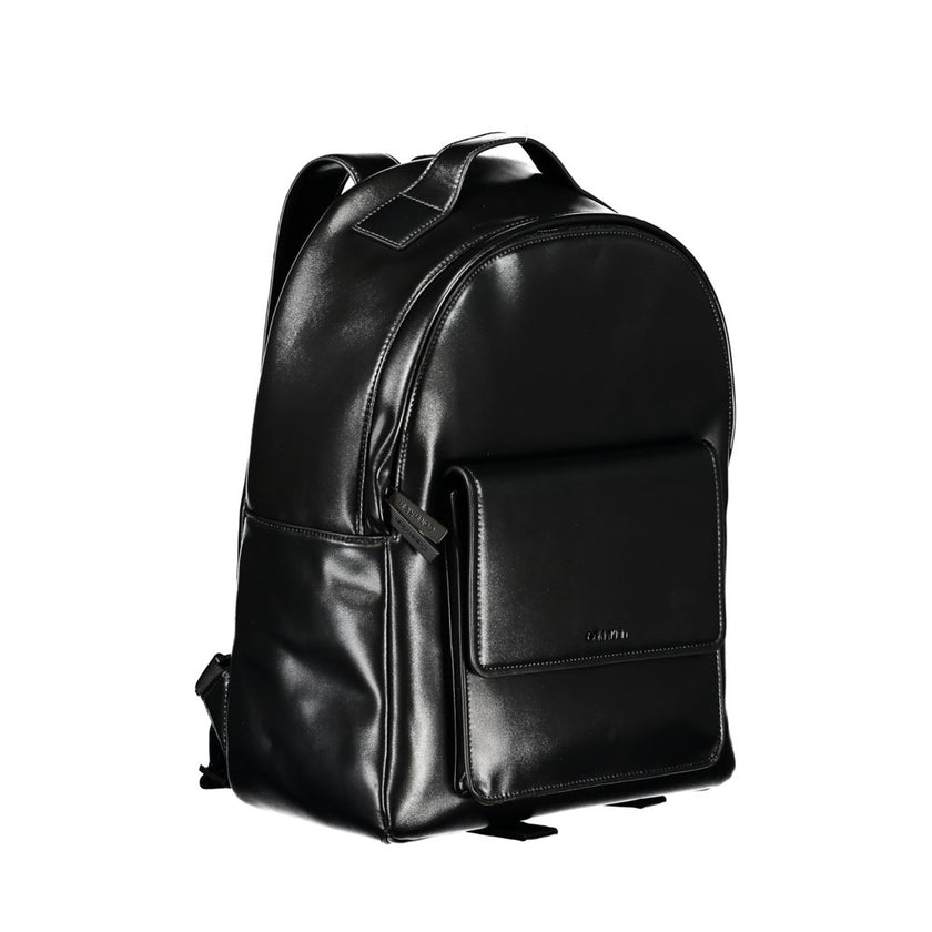 Elegant Black Urban Backpack with Laptop CompartmentUpgrade your accessory game with the Calvin Klein Backpack, tailored for the modern urbanite. This stylish backpack features a convenient single handle design, adjustable straps for personalized comfort,