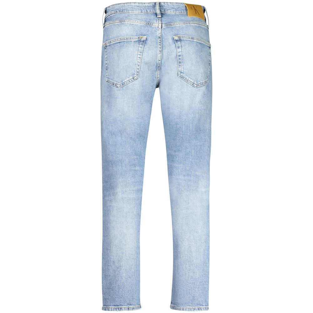 Blue Cotton Men JeansEmbrace the ultimate combination of eco-conscious fashion and timeless style with Calvin Klein’s reimagined dad jeans. Crafted with 20% recycled cotton, these jeans don’t just make a statement—they tell a story. With a fashion-forward