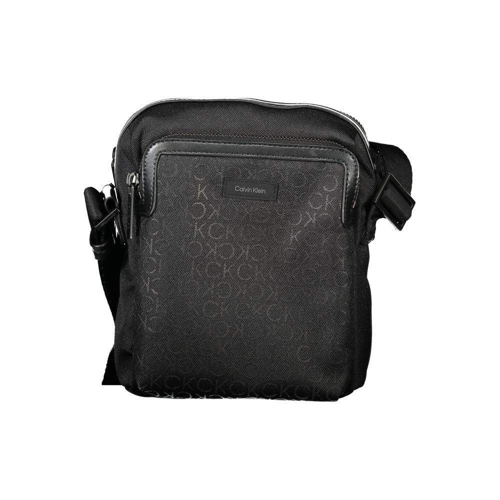 Black Polyester Men Shoulder BagElevate your accessory game with this sleek Calvin Klein shoulder bag. Meticulously crafted from premium materials, it’s designed for the modern man about town. The minimalist black hue is offset by striking contrasting det