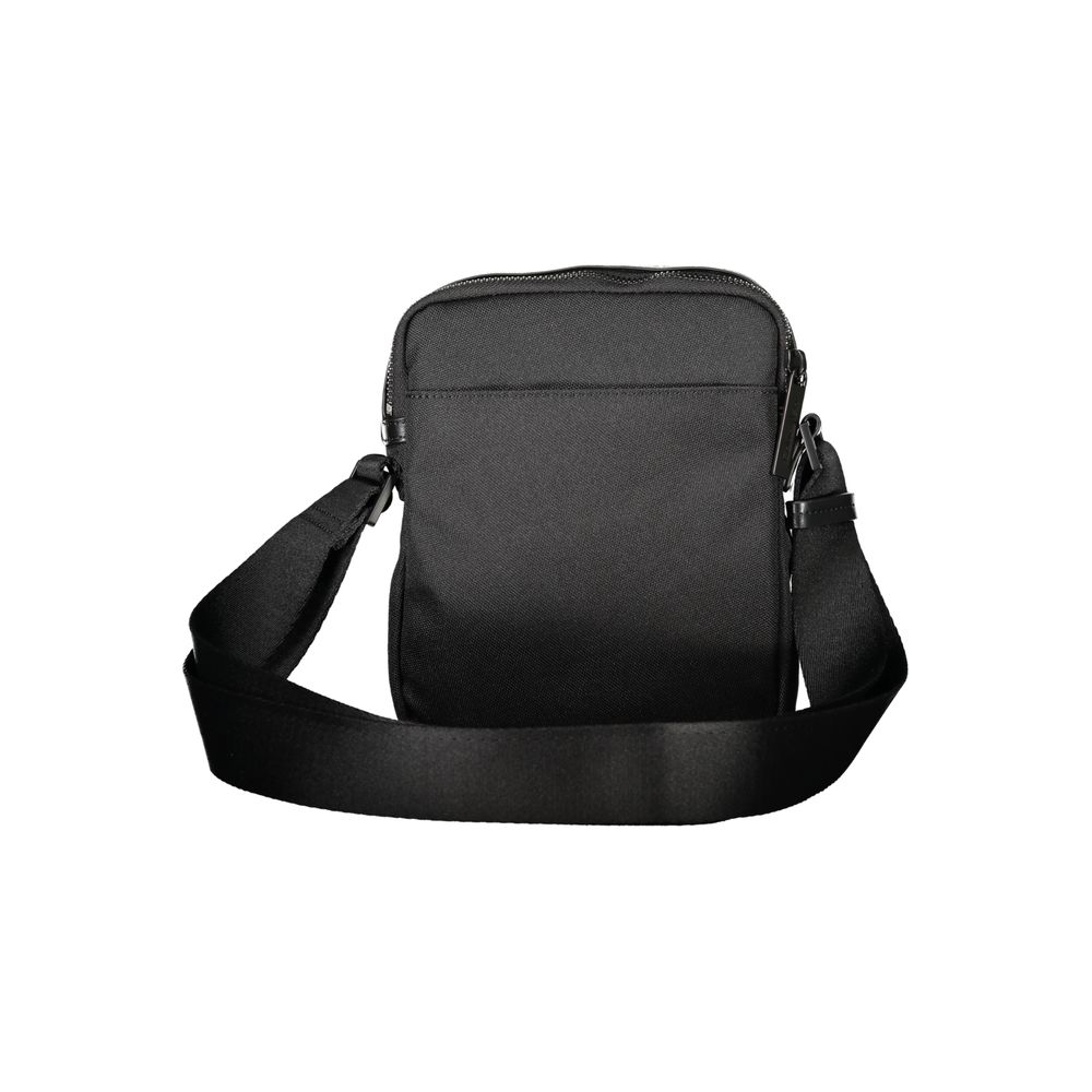 Black Polyester Men Shoulder BagElevate your accessory game with this sleek Calvin Klein shoulder bag. Meticulously crafted from premium materials, it’s designed for the modern man about town. The minimalist black hue is offset by striking contrasting det