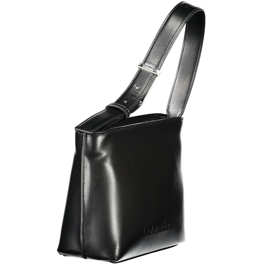 Black Polyester Women HandbagElevate your accessory game with this sleek Calvin Klein shoulder bag, a true embodiment of modern luxury. Crafted with a conscience, this bag boasts a 50% recycled polyester composition, seamlessly blending eco-friendly sensi