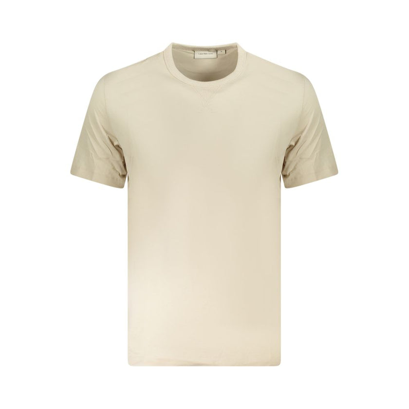 Beige Cotton Men T-ShirtExperience the epitome of sleek fashion with Calvin Klein’s latest creation that seamlessly melds sustainability and style. This short-sleeve T-shirt, with its crisp crew neck and eye-catching contrasting details, showcases the bra