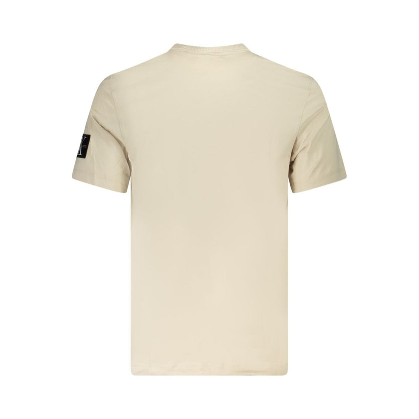Beige Cotton Men T-ShirtExperience the epitome of sleek fashion with Calvin Klein’s latest creation that seamlessly melds sustainability and style. This short-sleeve T-shirt, with its crisp crew neck and eye-catching contrasting details, showcases the bra