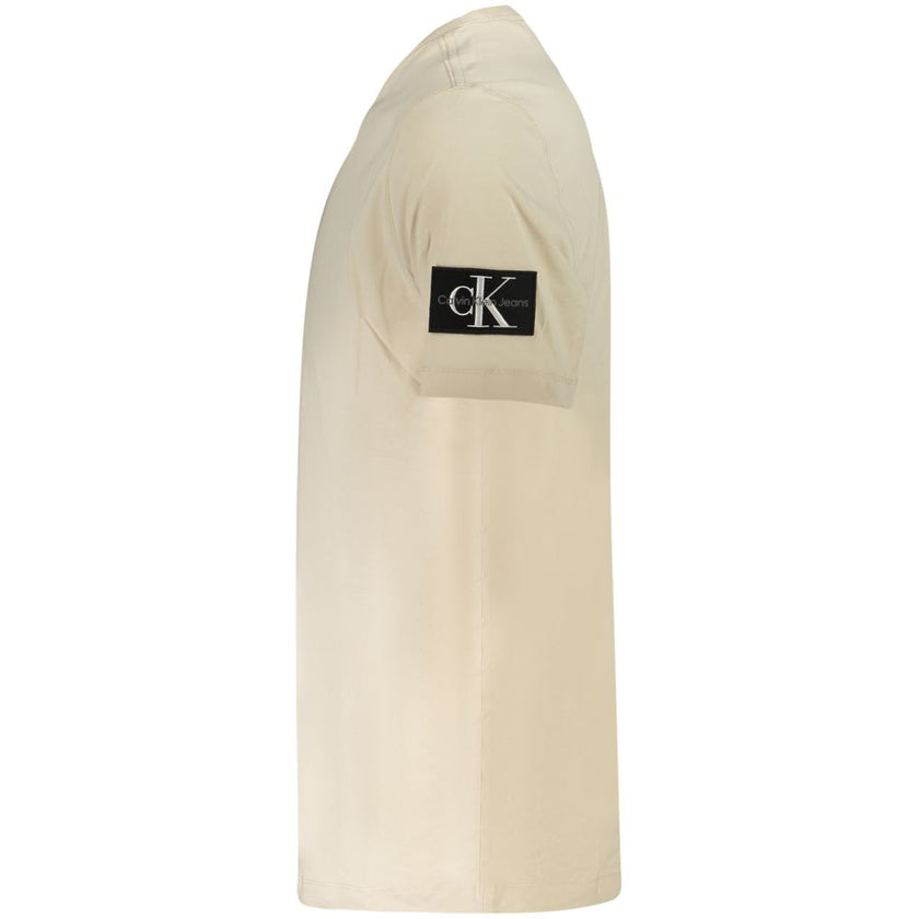 Beige Cotton Men T-ShirtExperience the epitome of sleek fashion with Calvin Klein’s latest creation that seamlessly melds sustainability and style. This short-sleeve T-shirt, with its crisp crew neck and eye-catching contrasting details, showcases the bra