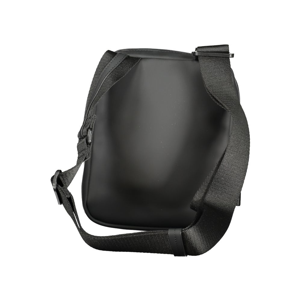 Black Polyester Men Shoulder BagStep out in bold sophistication with this Calvin Klein shoulder bag that effortlessly blends functionality with an edgy style. Designed for the modern individual, it features an adjustable shoulder strap for tailored comfor