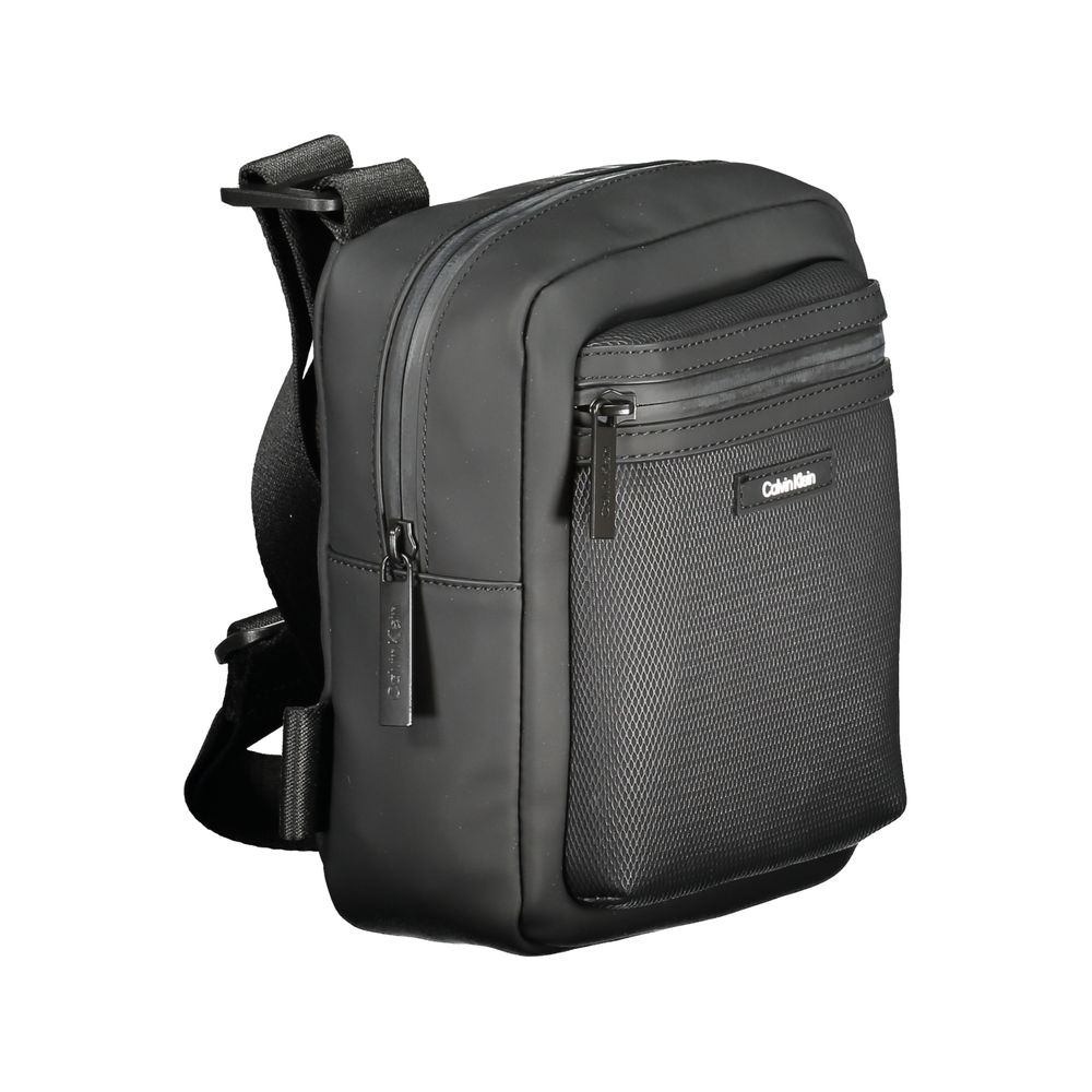 Black Polyester Men Shoulder BagStep out in bold sophistication with this Calvin Klein shoulder bag that effortlessly blends functionality with an edgy style. Designed for the modern individual, it features an adjustable shoulder strap for tailored comfor