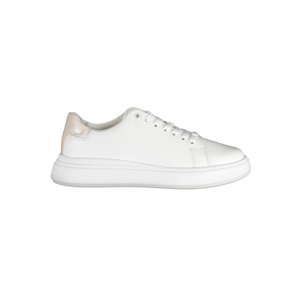 White Leather Women SneakerStep out in elevated style with these Calvin Klein sneakers, where sophistication meets urban chic. Flaunting contrasting details that add a touch of the unexpected, these shoes are emblazoned with the iconic logo, showcasing yo