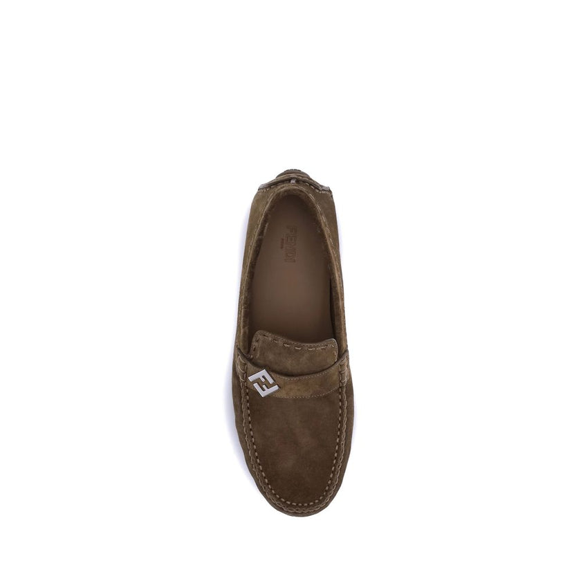 Brown Rubber Slip-On LoafersFendi’s Driver Loafers are made of soft suede and feature a rubber-injected sole for comfort and grip. They feature FF detail and Fendi lettering, while the upper is finished with an elegant metal FF detail with palladium finis
