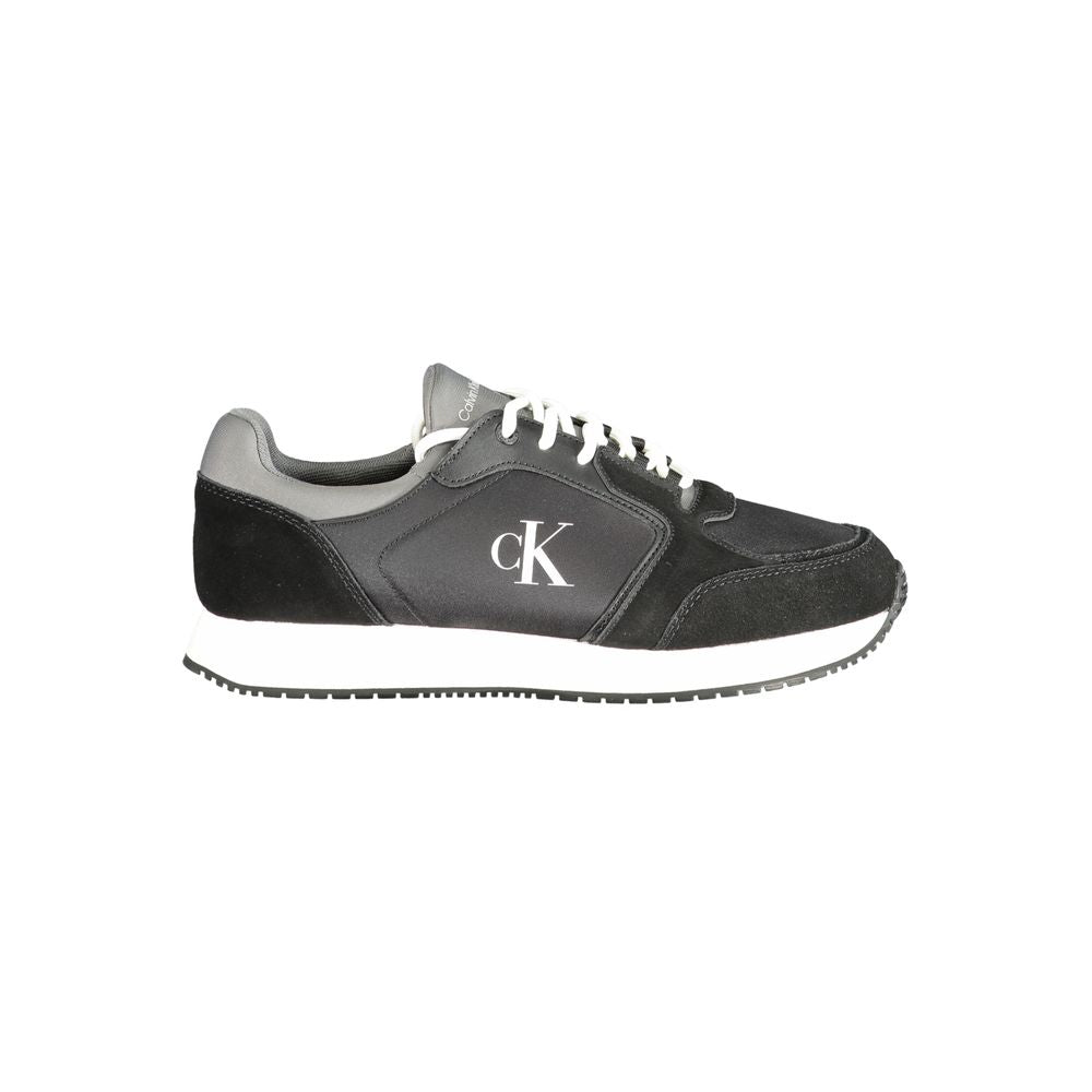 Black Leather Men SneakerElevate your sneaker game with the Calvin Klein edge. Crafted for the modern man, these dynamic sports shoes blend sleek black sophistication with bold contrasting details in grey and white that demand attention. Designed for both