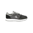 Black Leather Men SneakerElevate your sneaker game with the Calvin Klein edge. Crafted for the modern man, these dynamic sports shoes blend sleek black sophistication with bold contrasting details in grey and white that demand attention. Designed for both