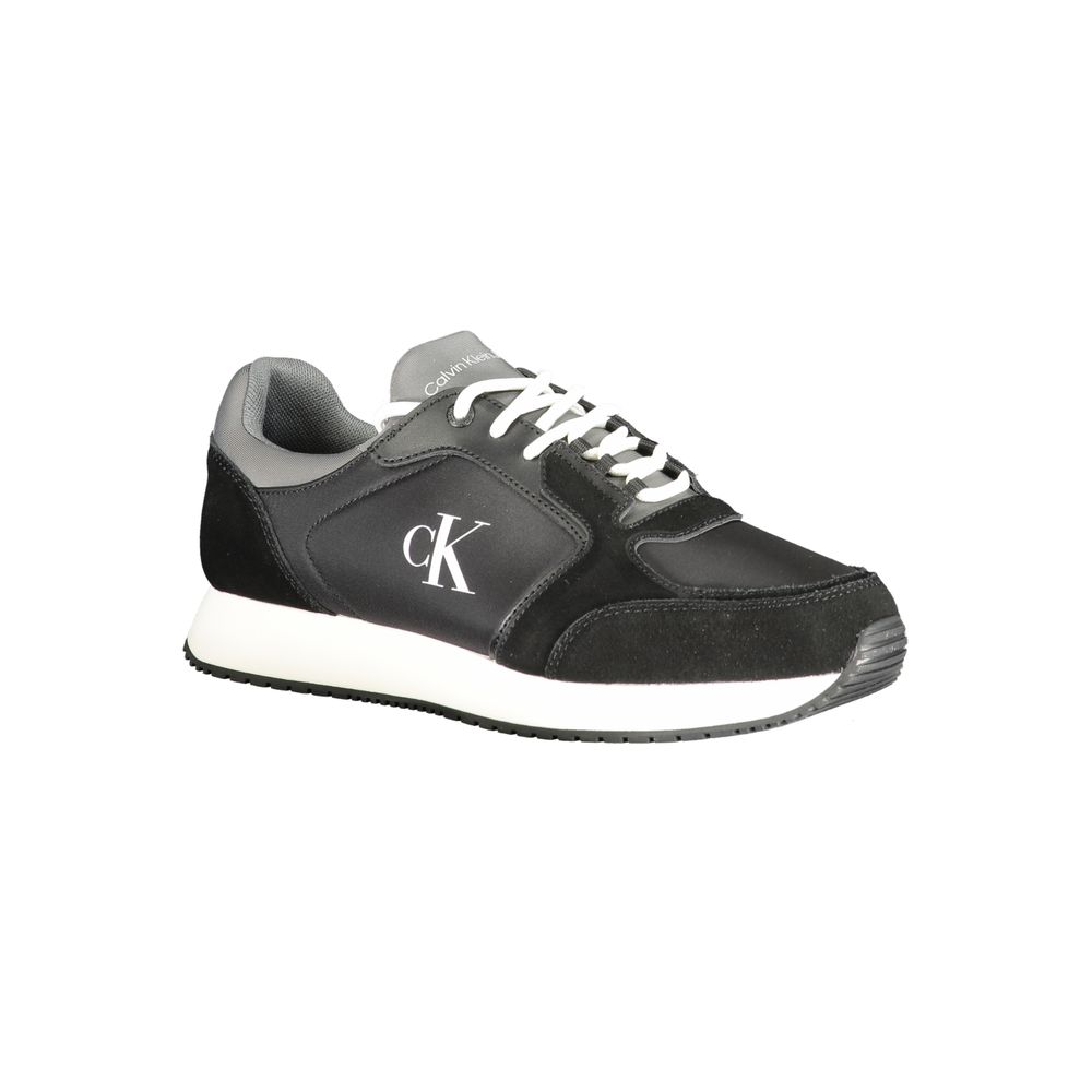 Black Leather Men SneakerElevate your sneaker game with the Calvin Klein edge. Crafted for the modern man, these dynamic sports shoes blend sleek black sophistication with bold contrasting details in grey and white that demand attention. Designed for both