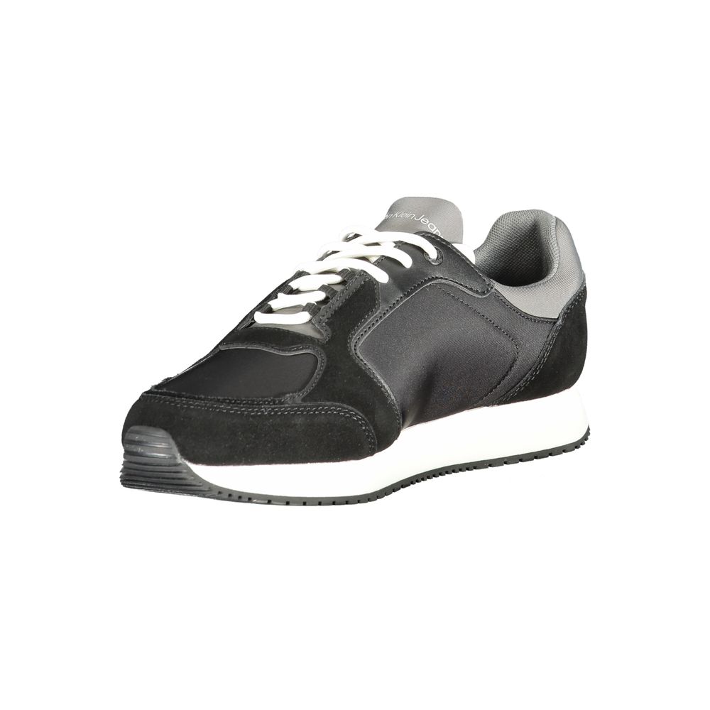 Black Leather Men SneakerElevate your sneaker game with the Calvin Klein edge. Crafted for the modern man, these dynamic sports shoes blend sleek black sophistication with bold contrasting details in grey and white that demand attention. Designed for both
