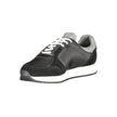 Black Leather Men SneakerElevate your sneaker game with the Calvin Klein edge. Crafted for the modern man, these dynamic sports shoes blend sleek black sophistication with bold contrasting details in grey and white that demand attention. Designed for both