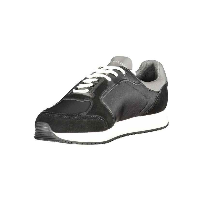 Black Leather Men SneakerElevate your sneaker game with the Calvin Klein edge. Crafted for the modern man, these dynamic sports shoes blend sleek black sophistication with bold contrasting details in grey and white that demand attention. Designed for both