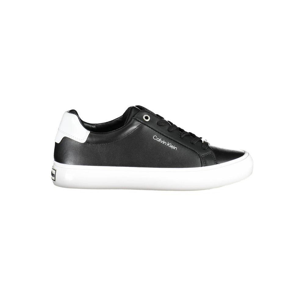 Black Leather Women SneakerUnleash confidence with every step in these Calvin Klein sneakers. Exuding urban elegance, they feature bold contrasting details and the iconic logo, signaling a fashionable twist on the athletic staple. Crafted from sustainable