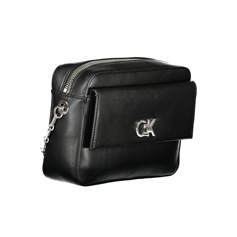 Black Polyester Women HandbagUnleash the epitome of sophistication with Calvin Klein’s latest offering: the quintessential shoulder bag that merges eco-conscious chic with unwavering functionality. Crafted with an eye for detail, it boasts an elegant exte
