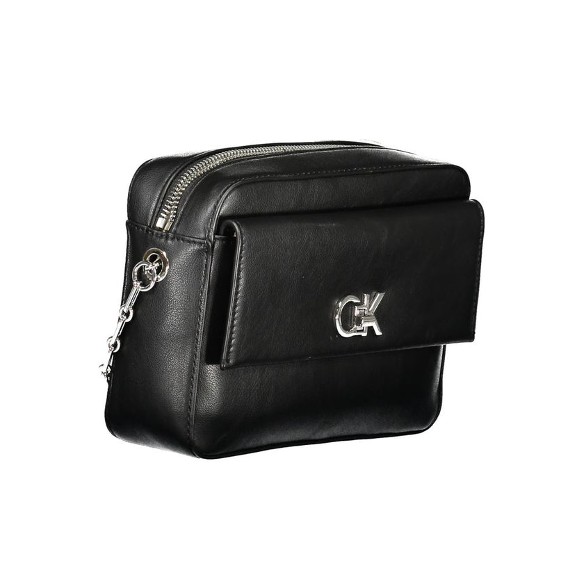 Black Polyester Women HandbagUnleash the epitome of sophistication with Calvin Klein’s latest offering: the quintessential shoulder bag that merges eco-conscious chic with unwavering functionality. Crafted with an eye for detail, it boasts an elegant exte