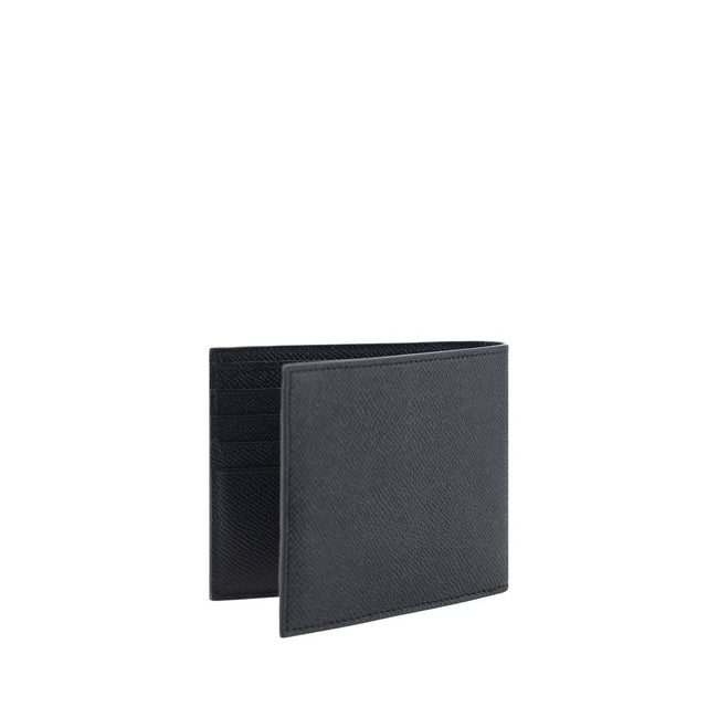Black Calf Leather Bos Taurus WalletCalfskin Wallet by Ferragamo, billfold model, grained leather design, banknote compartment, interior card slot, iconic brand monogram press-stamped on interior panel, three-dimensional iconic brand Gancini logo plaque a