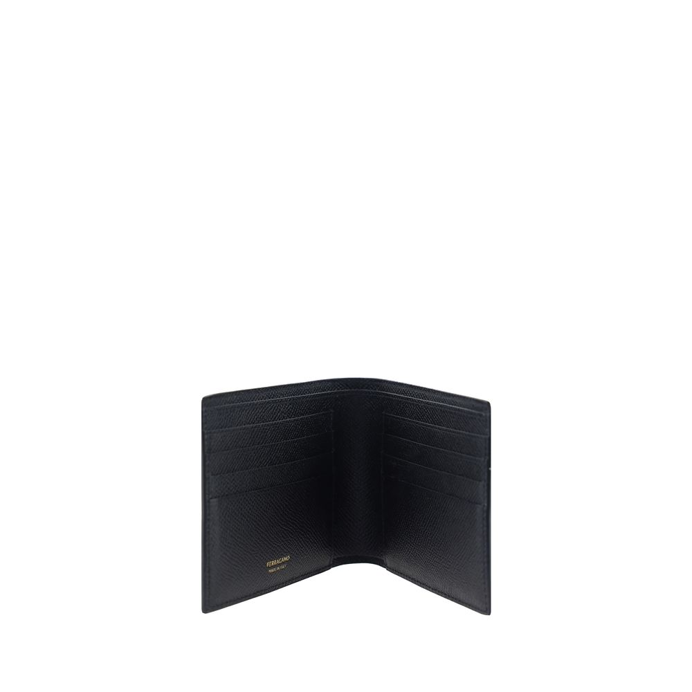 Black Calf Leather Bos Taurus WalletCalfskin Wallet by Ferragamo, billfold model, grained leather design, banknote compartment, interior card slot, iconic brand monogram press-stamped on interior panel, three-dimensional iconic brand Gancini logo plaque a