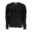 Sleek Organic Cotton Crew Neck SweaterA must-have for the modern man, this Calvin Klein sweater is the embodiment of comfort and style. The long sleeves and classic crew neck design make it a versatile piece for any wardrobe, while the subtle logo applica