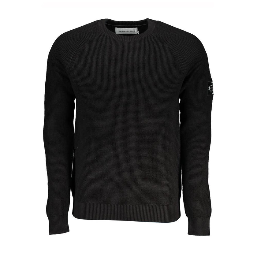 Sleek Organic Cotton Crew Neck SweaterA must-have for the modern man, this Calvin Klein sweater is the embodiment of comfort and style. The long sleeves and classic crew neck design make it a versatile piece for any wardrobe, while the subtle logo applica