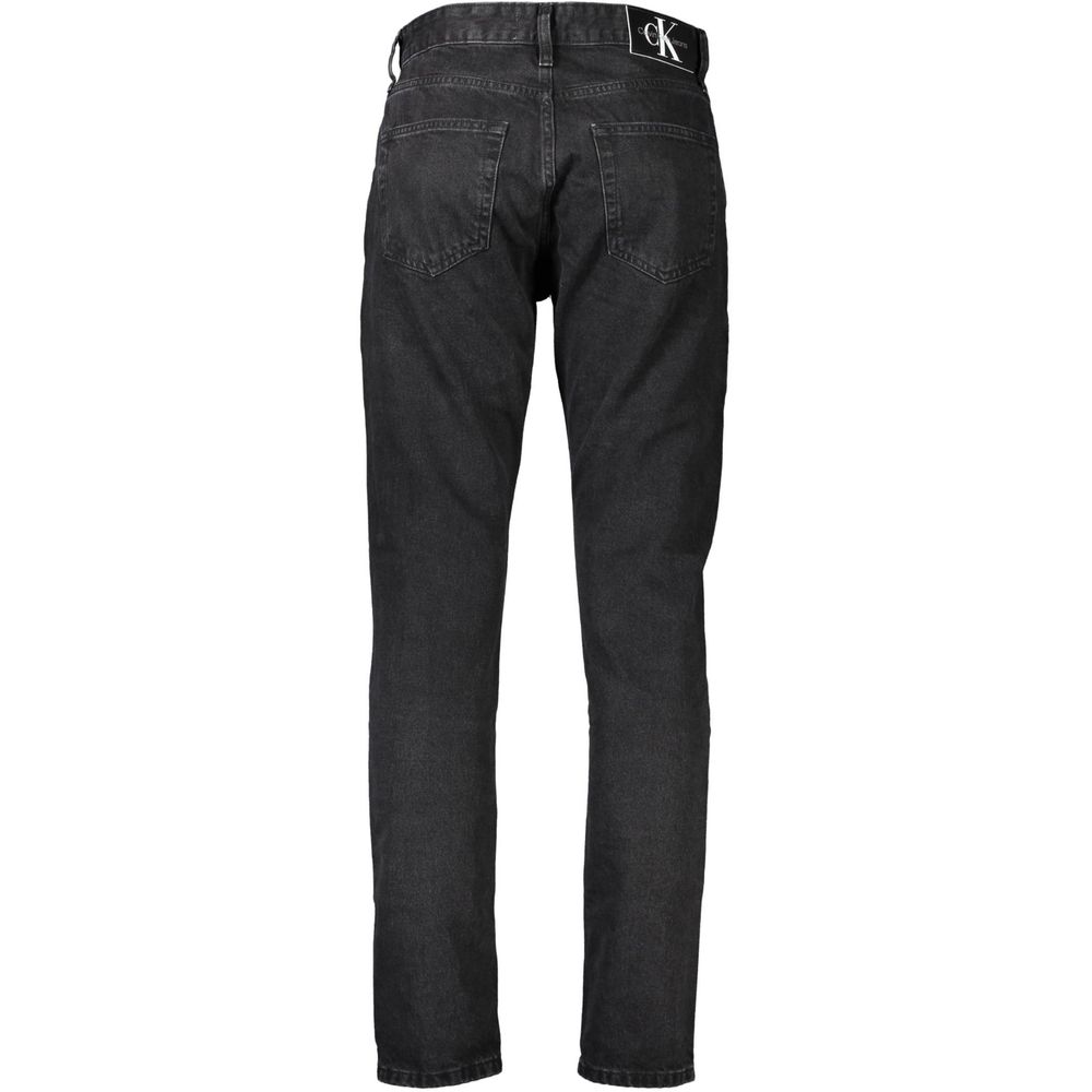 Black Cotton Men JeansEmbrace the epitome of sleek sophistication with Calvin Klein’s signature 5 pocket jeans. Designed to cater to the modern man’s desire for both comfort and style, these jeans feature a classic button and zip fastening, accented by bo