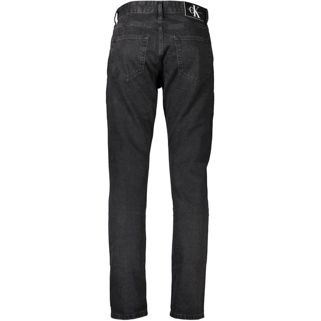 Black Cotton Men JeansEmbrace the epitome of sleek sophistication with Calvin Klein’s signature 5 pocket jeans. Designed to cater to the modern man’s desire for both comfort and style, these jeans feature a classic button and zip fastening, accented by bo