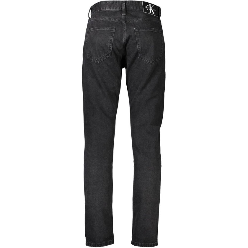 Black Cotton Men JeansEmbrace the epitome of sleek sophistication with Calvin Klein’s signature 5 pocket jeans. Designed to cater to the modern man’s desire for both comfort and style, these jeans feature a classic button and zip fastening, accented by bo