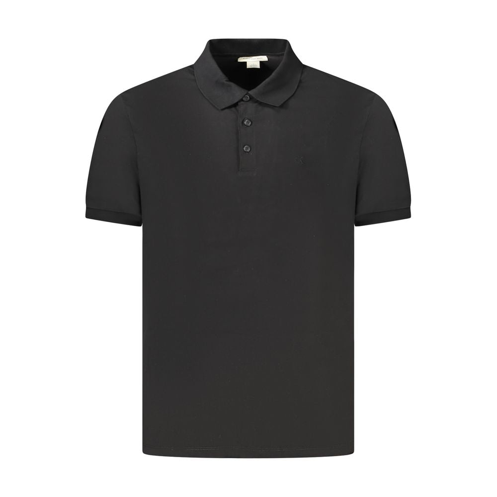 Black Cotton Men Polo ShirtElevate your wardrobe with a touch of sophistication in this Calvin Klein Classic Fit Polo. Crafted for those who demand both comfort and style, this short sleeve polo boasts a sleek black hue, complemented by the iconic Calvin
