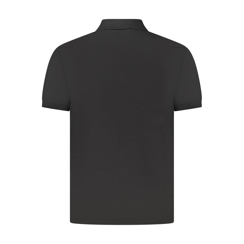 Black Cotton Men Polo ShirtElevate your wardrobe with a touch of sophistication in this Calvin Klein Classic Fit Polo. Crafted for those who demand both comfort and style, this short sleeve polo boasts a sleek black hue, complemented by the iconic Calvin