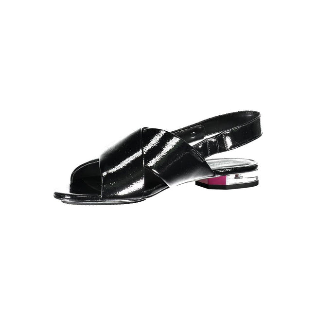 Black Leather Women SandalStep out in style and embrace the epitome of minimalist chic with these Calvin Klein Flat Sandals. Designed for the modern fashionista, they feature a subtle 1cm heel and an elegant crossed front, adorned with the iconic Calvin K