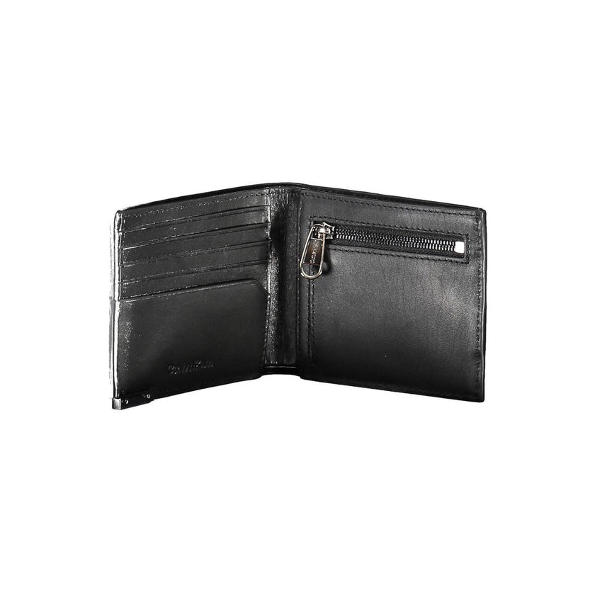 Black Leather Men WalletEmbark on your next journey with a dash of sophistication and security. This Calvin Klein wallet is not just an accessory; it’s a statement. Crafted in sumptuous leather, it features a sleek design that includes two spacious compar