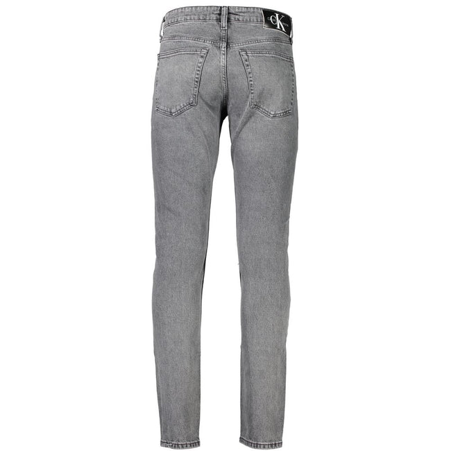 Gray Cotton Men JeansStep into the epitome of sleek sophistication with Calvin Klein’s Slim Taper Jeans. Perfectly engineered to blend style with comfort, these jeans boast an unmatched fit that’s both contemporary and timeless. Made for the modern trends